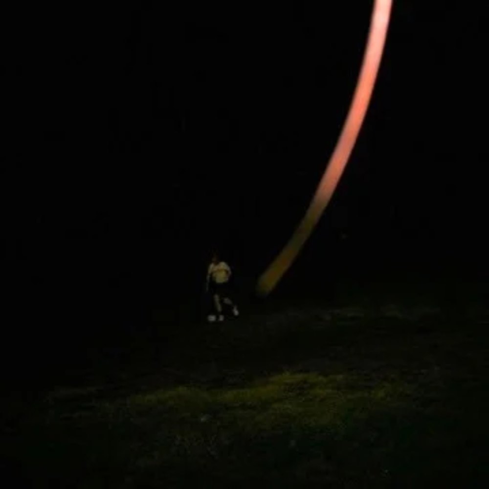 Cover of I Win: a small figure in a dark field beside a glowing orange arc of light